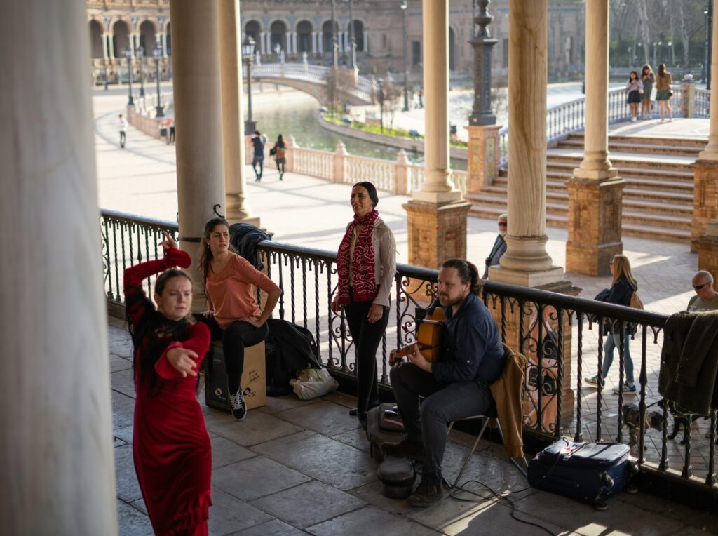 A Flamenco female dancer with other musicians in the famous Plaza de España, Sevilla, Spain

